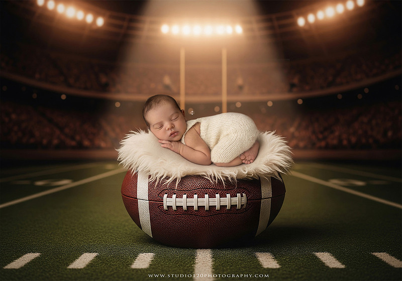 “newborn baby football themed photo with mini football and green turf backdrop”
“adorable infant posed with football props celebrating Super Bowl 2026 newborn session”
“sports baby photography football style end zone setup newborn portrait”