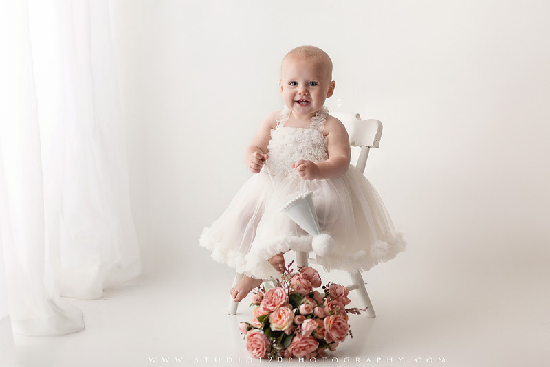 SOTP1959“classic first birthday portrait of baby in white dress on neutral studio backdrop”
“timeless baby portrait in white dress with soft light and minimal styling”
“elegant first birthday photography with baby seated on white chair and floral accents”
“luxury milestone portrait of baby in white dress with airy studio lighting”
“soft and neutral first birthday portrait session highlighting baby’s expression”
“studio milestone portrait with baby in white outfit and clean minimalist setting”
“fine art baby portrait in white dress with natural light and simple backdrop”
“classic first birthday photography focused on baby in white for timeless keepsakes”
