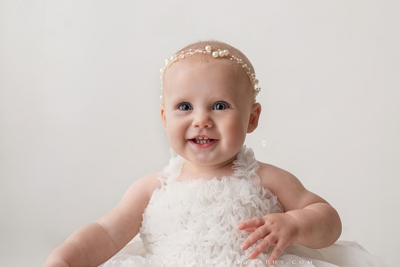 SOTP1959“classic first birthday portrait of baby in white dress on neutral studio backdrop”
“timeless baby portrait in white dress with soft light and minimal styling”
“elegant first birthday photography with baby seated on white chair and floral accents”
“luxury milestone portrait of baby in white dress with airy studio lighting”
“soft and neutral first birthday portrait session highlighting baby’s expression”
“studio milestone portrait with baby in white outfit and clean minimalist setting”
“fine art baby portrait in white dress with natural light and simple backdrop”
“classic first birthday photography focused on baby in white for timeless keepsakes”