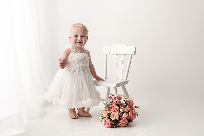 SOTP1959“classic first birthday portrait of baby in white dress on neutral studio backdrop”
“timeless baby portrait in white dress with soft light and minimal styling”
“elegant first birthday photography with baby seated on white chair and floral accents”
“luxury milestone portrait of baby in white dress with airy studio lighting”
“soft and neutral first birthday portrait session highlighting baby’s expression”
“studio milestone portrait with baby in white outfit and clean minimalist setting”
“fine art baby portrait in white dress with natural light and simple backdrop”
“classic first birthday photography focused on baby in white for timeless keepsakes”