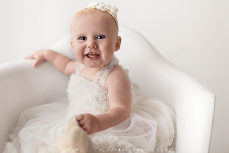 SOTP1959“classic first birthday portrait of baby in white dress on neutral studio backdrop”
“timeless baby portrait in white dress with soft light and minimal styling”
“elegant first birthday photography with baby seated on white chair and floral accents”
“luxury milestone portrait of baby in white dress with airy studio lighting”
“soft and neutral first birthday portrait session highlighting baby’s expression”
“studio milestone portrait with baby in white outfit and clean minimalist setting”
“fine art baby portrait in white dress with natural light and simple backdrop”
“classic first birthday photography focused on baby in white for timeless keepsakes”