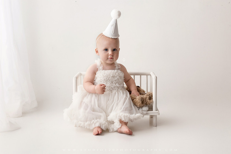 SOTP1959“classic first birthday portrait of baby in white dress on neutral studio backdrop”
“timeless baby portrait in white dress with soft light and minimal styling”
“elegant first birthday photography with baby seated on white chair and floral accents”
“luxury milestone portrait of baby in white dress with airy studio lighting”
“soft and neutral first birthday portrait session highlighting baby’s expression”
“studio milestone portrait with baby in white outfit and clean minimalist setting”
“fine art baby portrait in white dress with natural light and simple backdrop”
“classic first birthday photography focused on baby in white for timeless keepsakes”