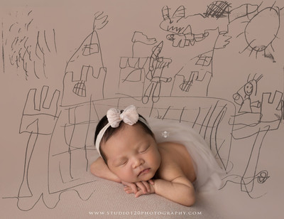 Hermès inspired newborn photography featuring baby girl posed in luxury orange gift box setup at Studio 120 Photography in San Diego County.