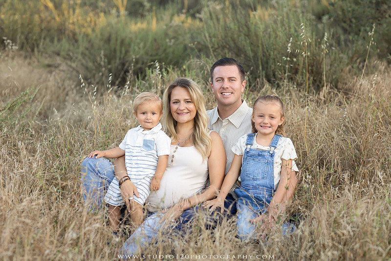 Outdoor maternity photography session in Ramona, CA featuring an expectant mother, father, and young children during golden hour with natural family portraits, pregnancy photos, and scenic Southern California landscapes by Studio 120 Photography.