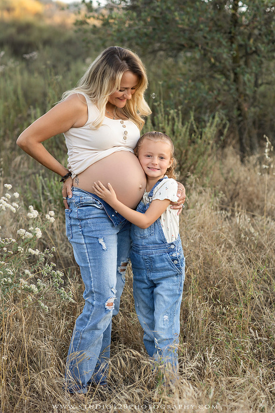 Outdoor maternity photography session in Ramona, CA featuring an expectant mother, father, and young children during golden hour with natural family portraits, pregnancy photos, and scenic Southern California landscapes by Studio 120 Photography.