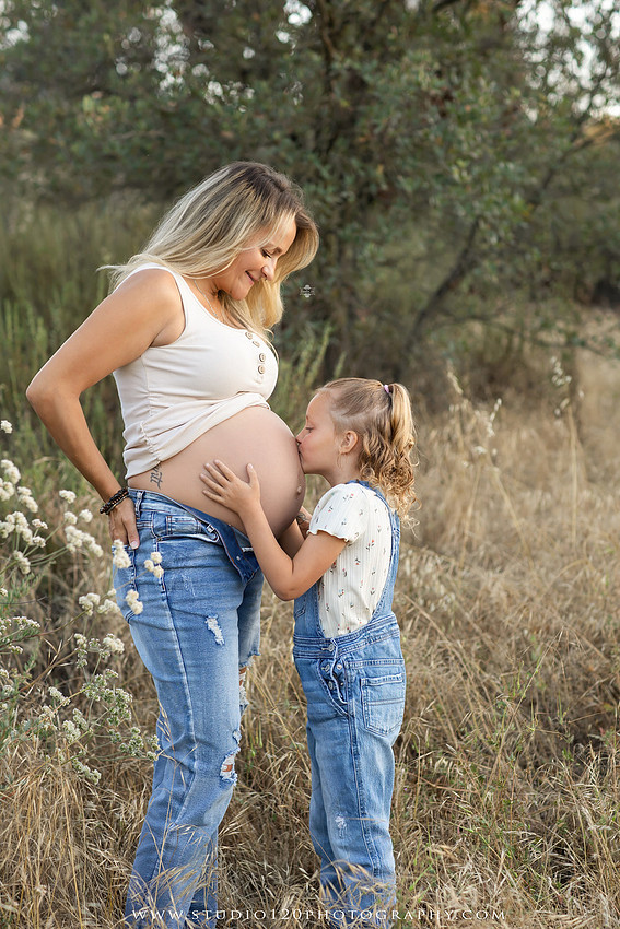 Outdoor maternity photography session in Ramona, CA featuring an expectant mother, father, and young children during golden hour with natural family portraits, pregnancy photos, and scenic Southern California landscapes by Studio 120 Photography.
