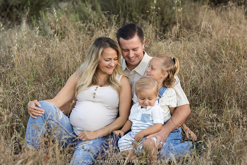 Outdoor maternity photography session in Ramona, CA featuring an expectant mother, father, and young children during golden hour with natural family portraits, pregnancy photos, and scenic Southern California landscapes by Studio 120 Photography.