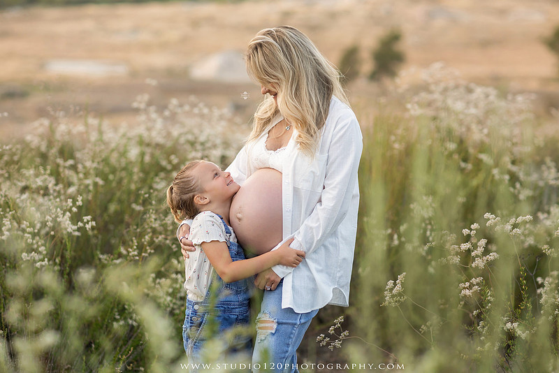 Outdoor maternity photography session in Ramona, CA featuring an expectant mother, father, and young children during golden hour with natural family portraits, pregnancy photos, and scenic Southern California landscapes by Studio 120 Photography.