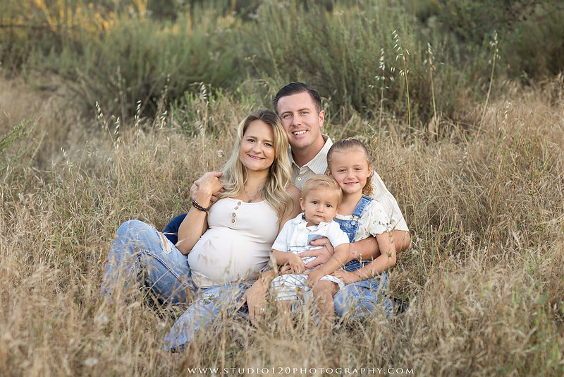 Outdoor maternity photography session in Ramona, CA featuring an expectant mother, father, and young children during golden hour with natural family portraits, pregnancy photos, and scenic Southern California landscapes by Studio 120 Photography.