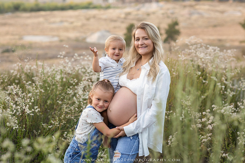 Outdoor maternity photography session in Ramona, CA featuring an expectant mother, father, and young children during golden hour with natural family portraits, pregnancy photos, and scenic Southern California landscapes by Studio 120 Photography.