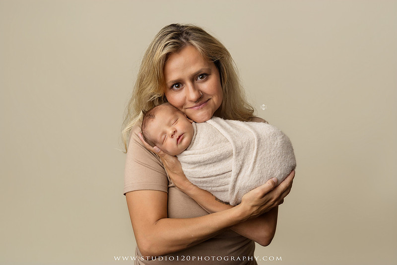 Professional newborn photography session in Ramona featuring a sleeping baby boy, sibling portraits, loving family photos, timeless neutral styling, wrapped newborn poses, and classic studio portraits by Studio 120 Photography.