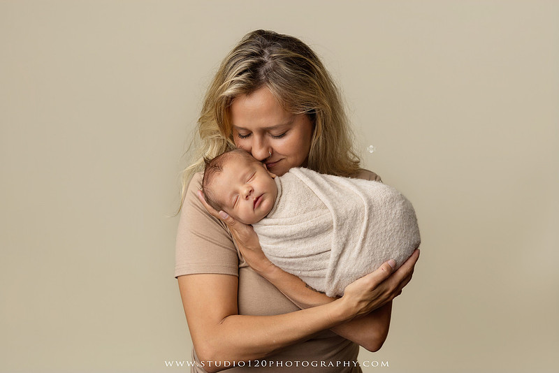 Professional newborn photography session in Ramona featuring a sleeping baby boy, sibling portraits, loving family photos, timeless neutral styling, wrapped newborn poses, and classic studio portraits by Studio 120 Photography.