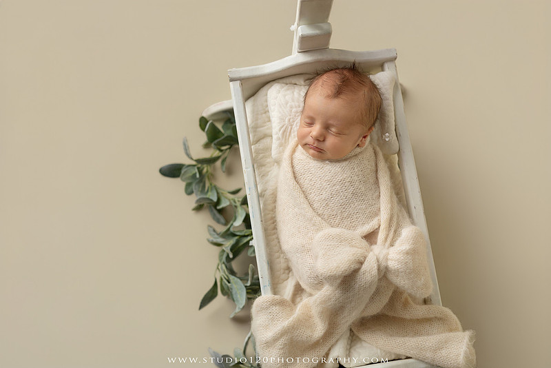 Professional newborn photography session in Ramona featuring a sleeping baby boy, sibling portraits, loving family photos, timeless neutral styling, wrapped newborn poses, and classic studio portraits by Studio 120 Photography.