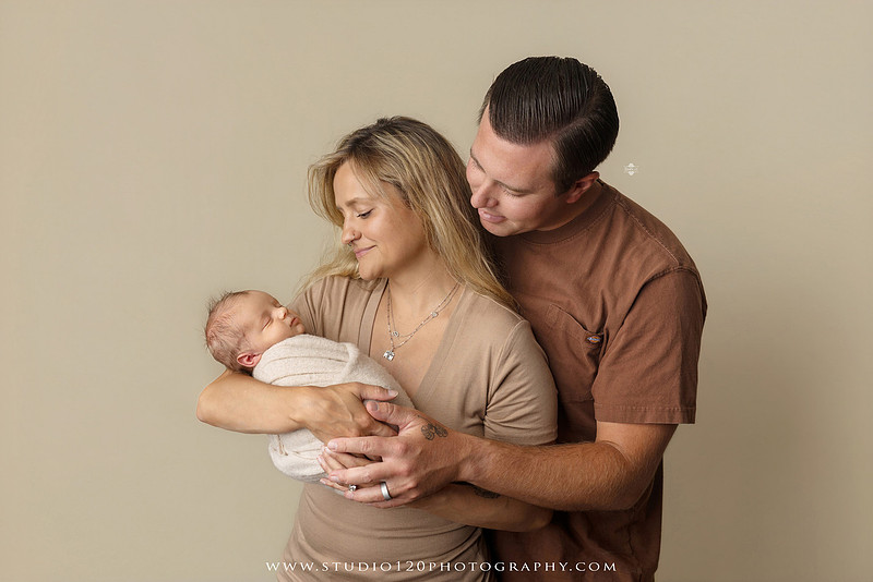 Professional newborn photography session in Ramona featuring a sleeping baby boy, sibling portraits, loving family photos, timeless neutral styling, wrapped newborn poses, and classic studio portraits by Studio 120 Photography.
