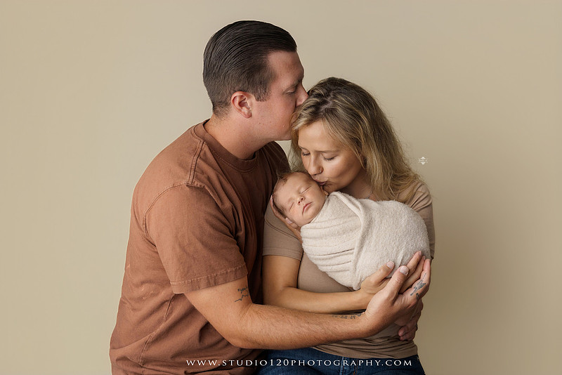 Professional newborn photography session in Ramona featuring a sleeping baby boy, sibling portraits, loving family photos, timeless neutral styling, wrapped newborn poses, and classic studio portraits by Studio 120 Photography.