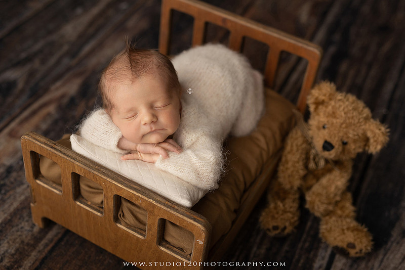 Professional newborn photography session in Ramona featuring a sleeping baby boy, sibling portraits, loving family photos, timeless neutral styling, wrapped newborn poses, and classic studio portraits by Studio 120 Photography.