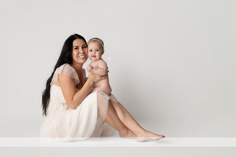 Professional milestone photography session in Ramona featuring a smiling baby girl, mother and baby portraits, classic sitter milestone photos, timeless neutral styling, and first year baby photography by Studio 120 Photography.