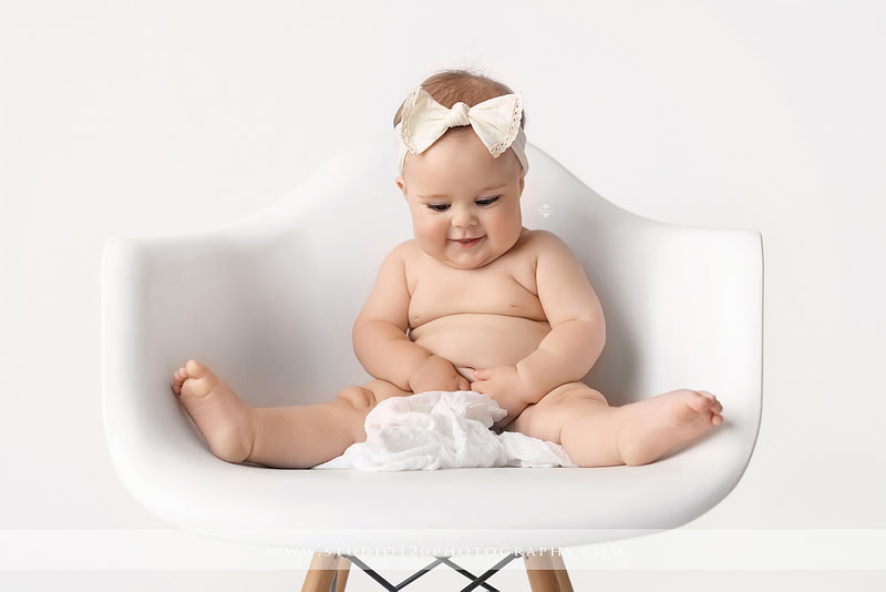 Professional milestone photography session in Ramona featuring a smiling baby girl, mother and baby portraits, classic sitter milestone photos, timeless neutral styling, and first year baby photography by Studio 120 Photography.