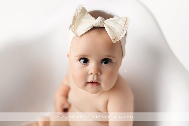 Professional milestone photography session in Ramona featuring a smiling baby girl, mother and baby portraits, classic sitter milestone photos, timeless neutral styling, and first year baby photography by Studio 120 Photography.