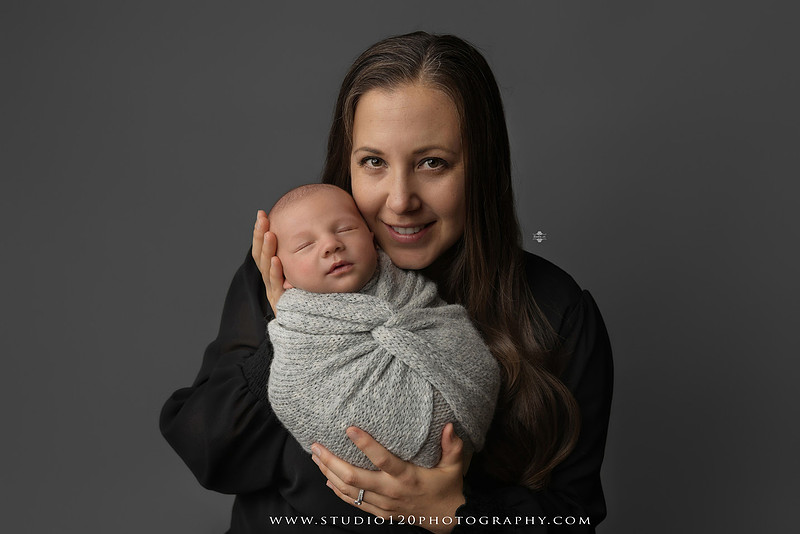 Professional newborn photography session in Ramona featuring a sleeping baby boy, sibling and family portraits, timeless wrapped newborn poses, custom racing-themed portraits, and classic studio photography by Studio 120 Photography.