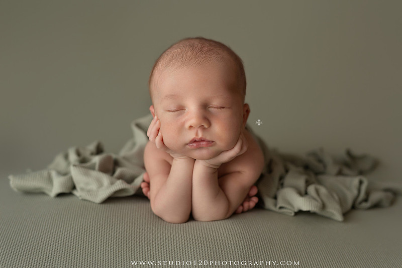 Professional newborn photography session in Ramona featuring a sleeping baby boy, sibling and family portraits, timeless wrapped newborn poses, custom racing-themed portraits, and classic studio photography by Studio 120 Photography.