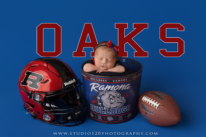 Professional newborn photography session featuring baby girl Astrid with custom Ramona Bulldogs football-themed portraits, a handcrafted Bulldogs newborn bucket wrap, football helmet and football, soft neutral newborn poses, vintage wooden bed with floral styling, plush bunny, blush and cream wraps, personalized 3D printed name sign, custom ASTRID letter artwork, and timeless studio newborn portraits by Studio 120 Photography in Ramona, CA.