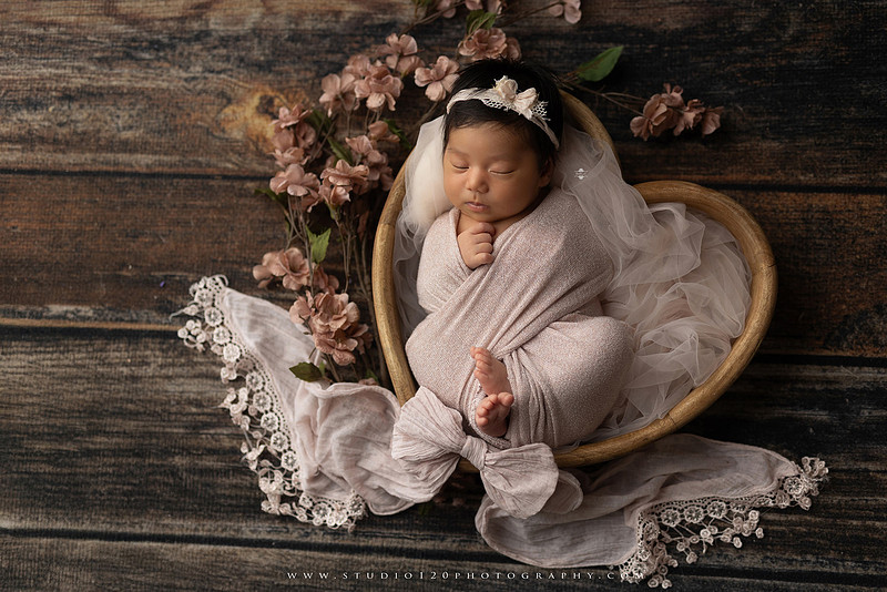 Newborn photography session at Studio 120 Photography in Ramona, California, featuring a baby girl in soft pink, cream, floral and neutral setups, custom portraits with her mother’s Labubu doll collection, sibling photos with her three big brothers, family portraits with Mom and Dad, and timeless baby-only images.