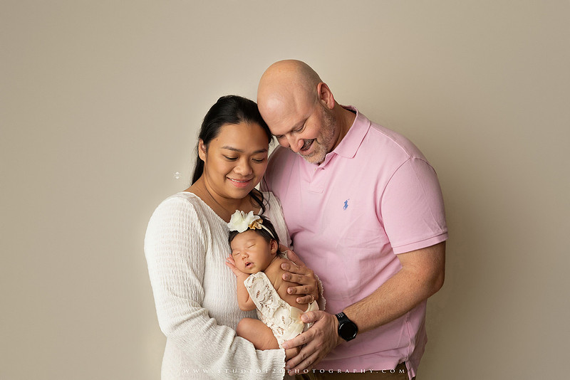 Newborn photography session at Studio 120 Photography in Ramona, California, featuring a baby girl in soft pink, cream, floral and neutral setups, custom portraits with her mother’s Labubu doll collection, sibling photos with her three big brothers, family portraits with Mom and Dad, and timeless baby-only images.
