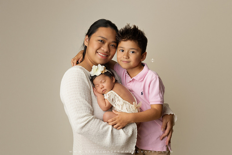 Newborn photography session at Studio 120 Photography in Ramona, California, featuring a baby girl in soft pink, cream, floral and neutral setups, custom portraits with her mother’s Labubu doll collection, sibling photos with her three big brothers, family portraits with Mom and Dad, and timeless baby-only images.