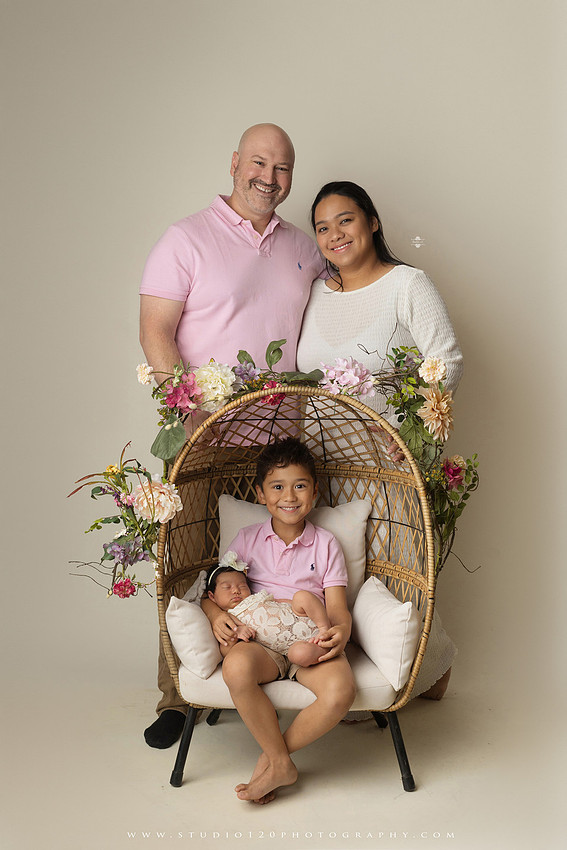 Newborn photography session at Studio 120 Photography in Ramona, California, featuring a baby girl in soft pink, cream, floral and neutral setups, custom portraits with her mother’s Labubu doll collection, sibling photos with her three big brothers, family portraits with Mom and Dad, and timeless baby-only images.