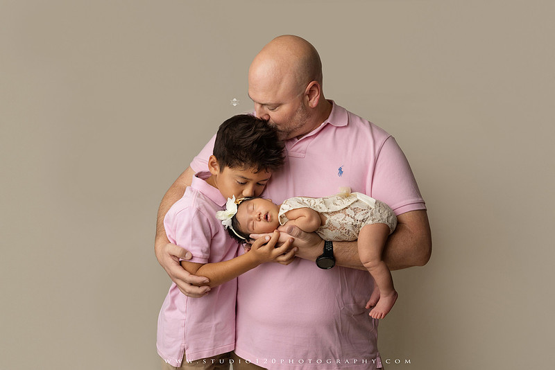 Newborn photography session at Studio 120 Photography in Ramona, California, featuring a baby girl in soft pink, cream, floral and neutral setups, custom portraits with her mother’s Labubu doll collection, sibling photos with her three big brothers, family portraits with Mom and Dad, and timeless baby-only images.