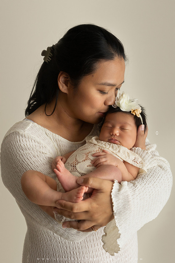 Newborn photography session at Studio 120 Photography in Ramona, California, featuring a baby girl in soft pink, cream, floral and neutral setups, custom portraits with her mother’s Labubu doll collection, sibling photos with her three big brothers, family portraits with Mom and Dad, and timeless baby-only images.
