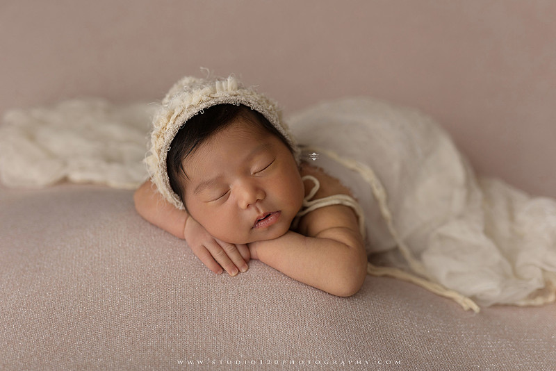 Newborn photography session at Studio 120 Photography in Ramona, California, featuring a baby girl in soft pink, cream, floral and neutral setups, custom portraits with her mother’s Labubu doll collection, sibling photos with her three big brothers, family portraits with Mom and Dad, and timeless baby-only images.