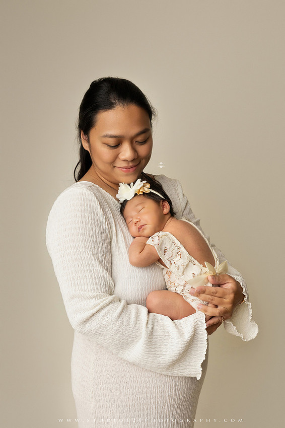 Newborn photography session at Studio 120 Photography in Ramona, California, featuring a baby girl in soft pink, cream, floral and neutral setups, custom portraits with her mother’s Labubu doll collection, sibling photos with her three big brothers, family portraits with Mom and Dad, and timeless baby-only images.