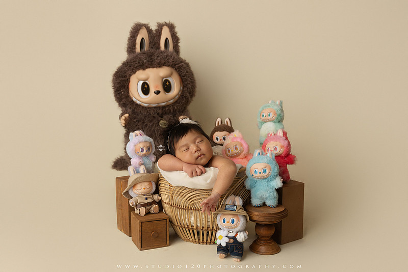 Newborn photography session at Studio 120 Photography in Ramona, California, featuring a baby girl in soft pink, cream, floral and neutral setups, custom portraits with her mother’s Labubu doll collection, sibling photos with her three big brothers, family portraits with Mom and Dad, and timeless baby-only images.