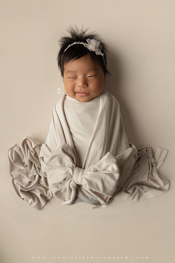 Newborn photography session at Studio 120 Photography in Ramona, California, featuring a baby girl in soft pink, cream, floral and neutral setups, custom portraits with her mother’s Labubu doll collection, sibling photos with her three big brothers, family portraits with Mom and Dad, and timeless baby-only images.