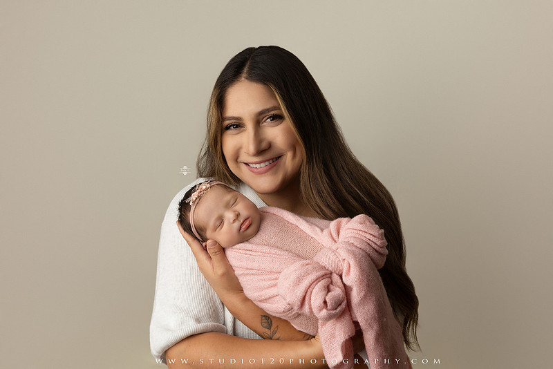 Newborn baby girl photography session featuring soft pink, lavender, blue and neutral styling, floral newborn portraits, rustic western-inspired setups, sibling photos with two big brothers, and family portraits with parents at Studio 120 Photography in Ramona, California.