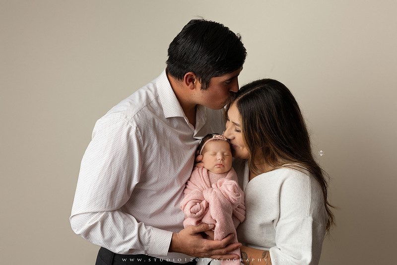 Newborn baby girl photography session featuring soft pink, lavender, blue and neutral styling, floral newborn portraits, rustic western-inspired setups, sibling photos with two big brothers, and family portraits with parents at Studio 120 Photography in Ramona, California.