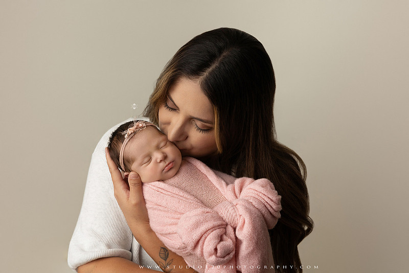 Newborn baby girl photography session featuring soft pink, lavender, blue and neutral styling, floral newborn portraits, rustic western-inspired setups, sibling photos with two big brothers, and family portraits with parents at Studio 120 Photography in Ramona, California.