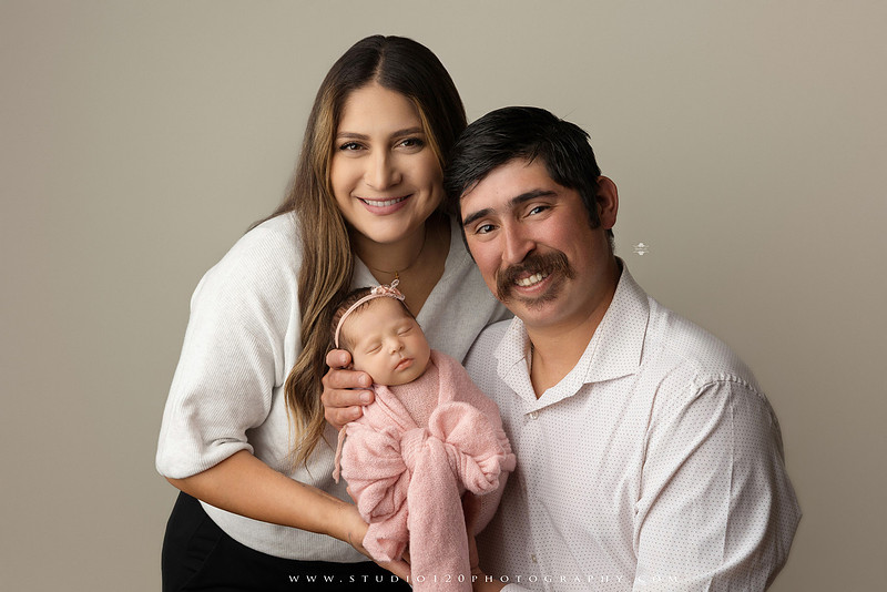 Newborn baby girl photography session featuring soft pink, lavender, blue and neutral styling, floral newborn portraits, rustic western-inspired setups, sibling photos with two big brothers, and family portraits with parents at Studio 120 Photography in Ramona, California.