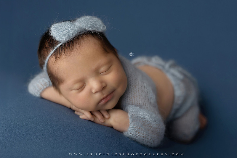 Newborn baby girl photography session featuring soft pink, lavender, blue and neutral styling, floral newborn portraits, rustic western-inspired setups, sibling photos with two big brothers, and family portraits with parents at Studio 120 Photography in Ramona, California.